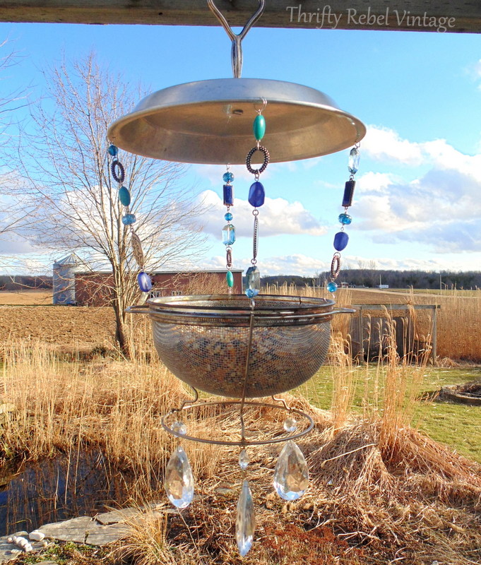 repurposed vintage sieve bird feeder
