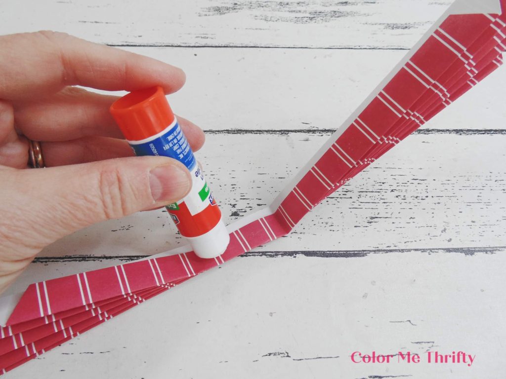 using stick glue on the insides of folded paper