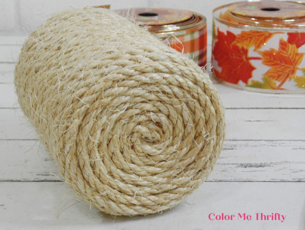 bottom of peanut butter jar covered with sisal rope