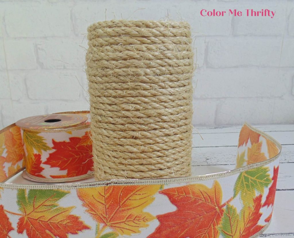 finished gluing sisal rope around peanut butter jar
