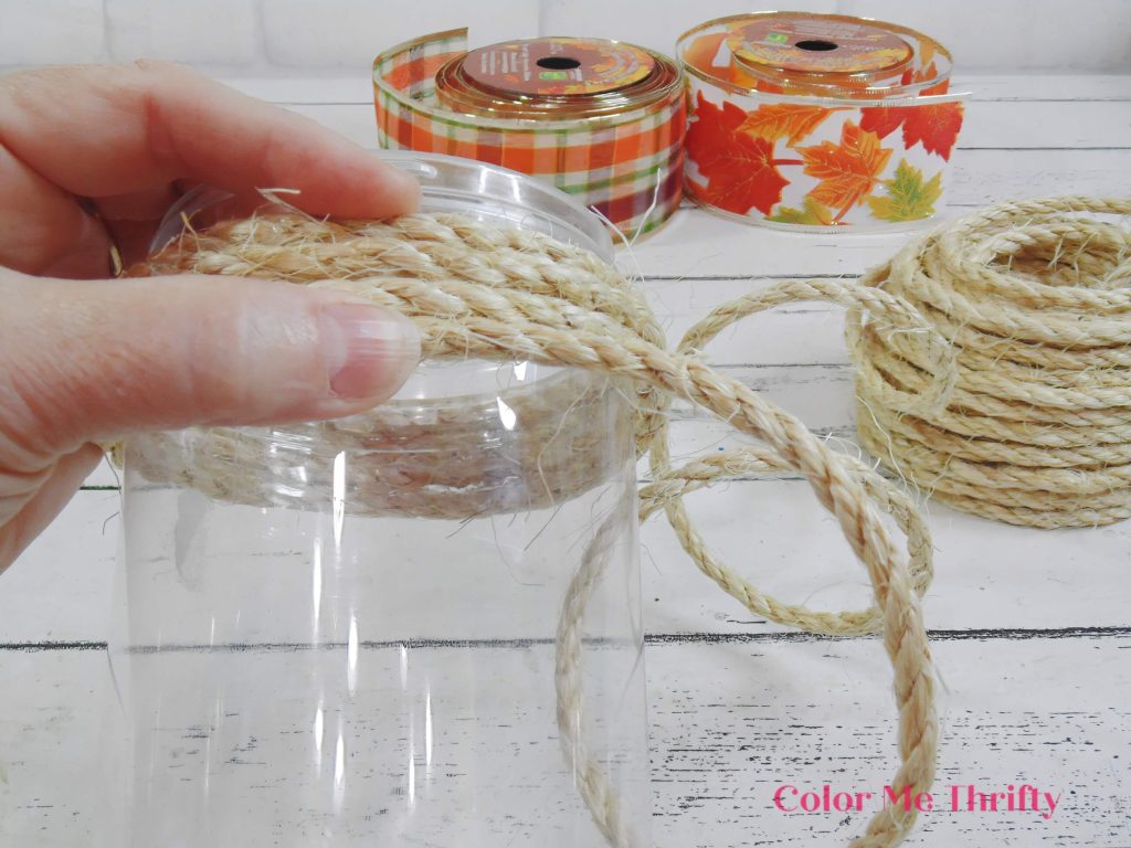 hot gluing sisal rope onto peanut butter jar